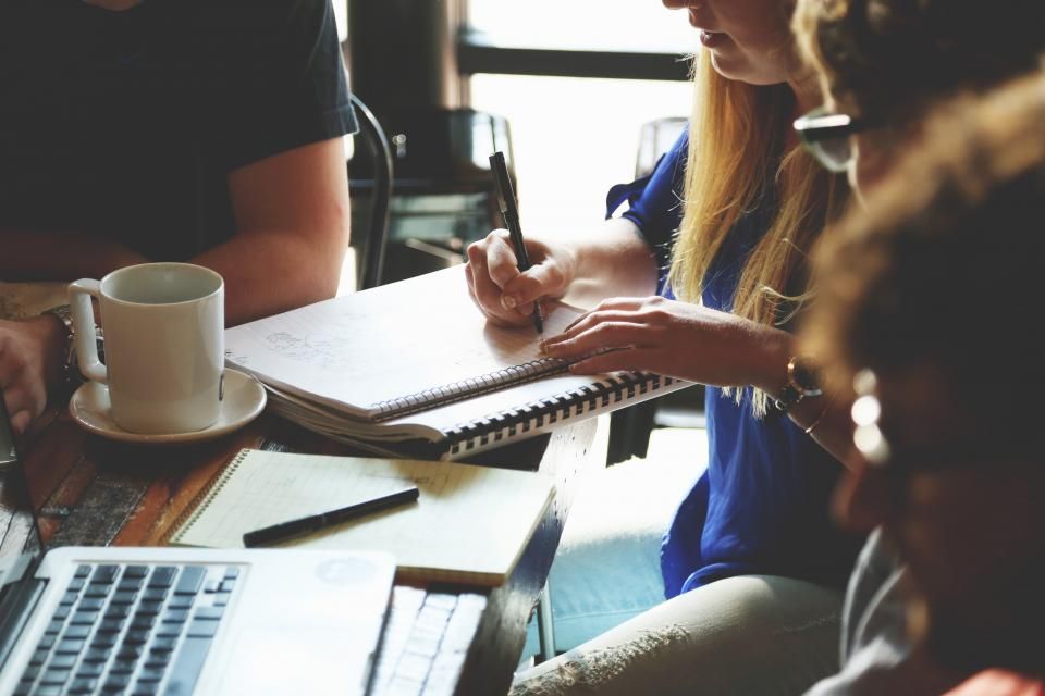 A small team working together around a table